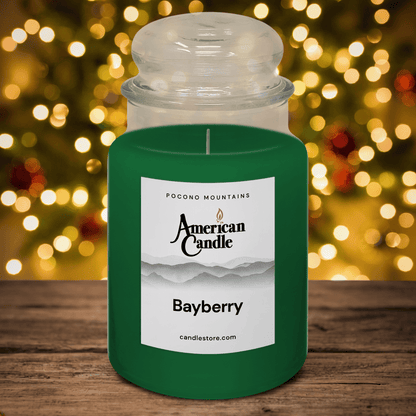 American Candle Bayberry Scented Jar Candle on Wooden Table with Holiday Christmas Lights in the Background
