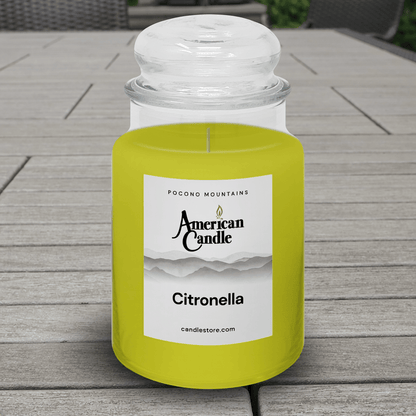 American Candle Citronella Scented Jar Candle on Patio Table in Backyard to prevent bugs