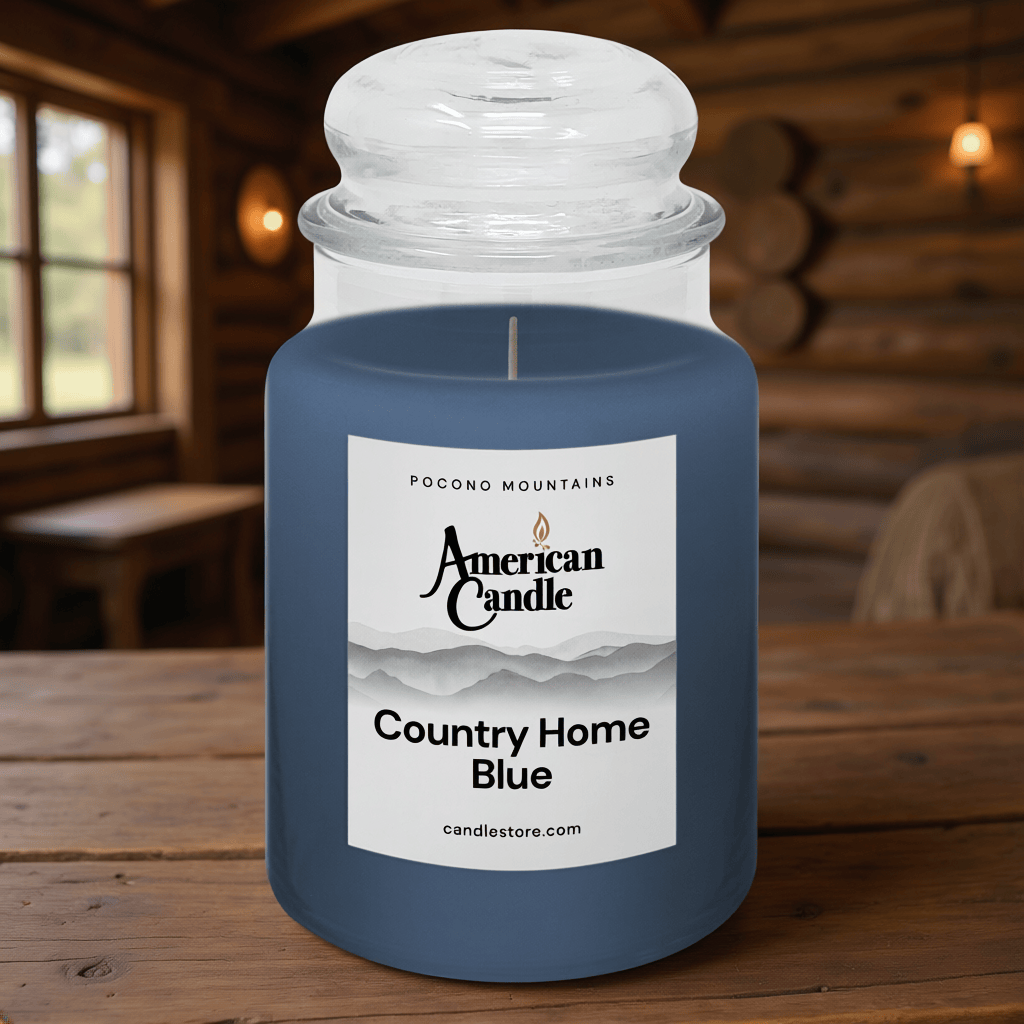 American Candle County Home Blue Scented Jar Candle on Wooden Table inside a Log Cabin