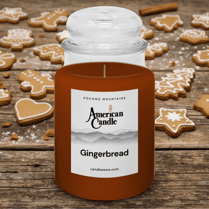 American Candle Gingerbread Scented Jar Candle on a Wooden Table with Gingerbread Cookies on the Table
