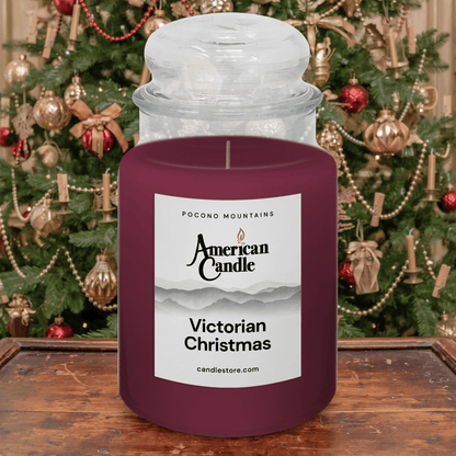 American Candle Victorian Christmas Jar Scented Candle in front of a decorated Holiday Christmas tree