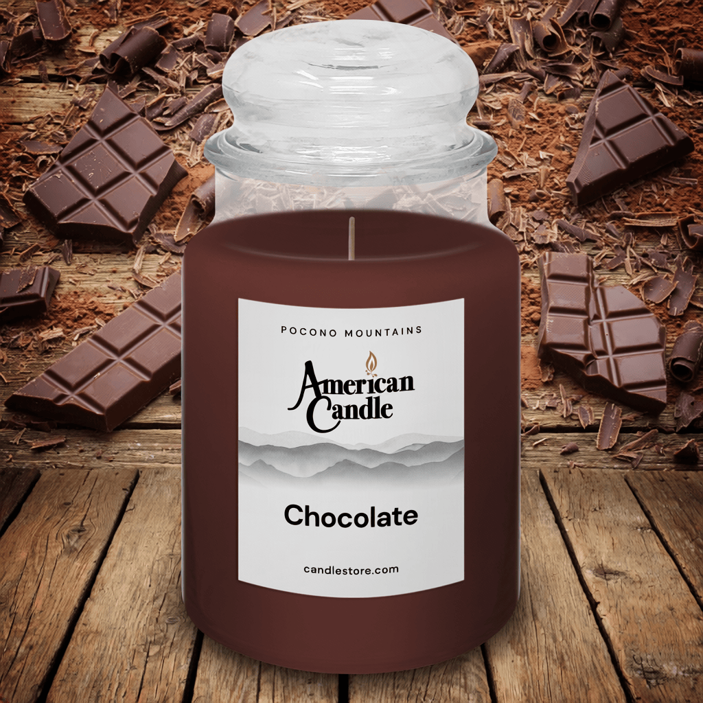 American Candle Chocolate-scented jar candle on a wooden stable with chocolate pieces