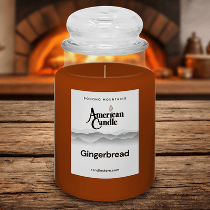 American Candle Gingerbread scented Jar candle on a wooden table fireplace oven in the background