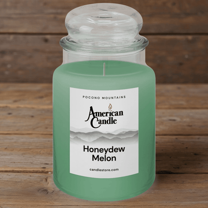 American Candle Honeydew Melon Scented Jar Candle on a wooden table