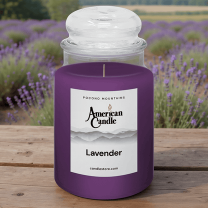 American Candle Lavender Scented Jar candle on wooden table with lavender field orchard
