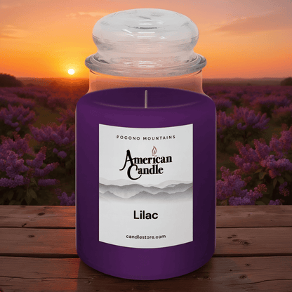 American Candle Lilac Scented Jar Candle on Wooden Table with Sunset in Lilacs Orchard
