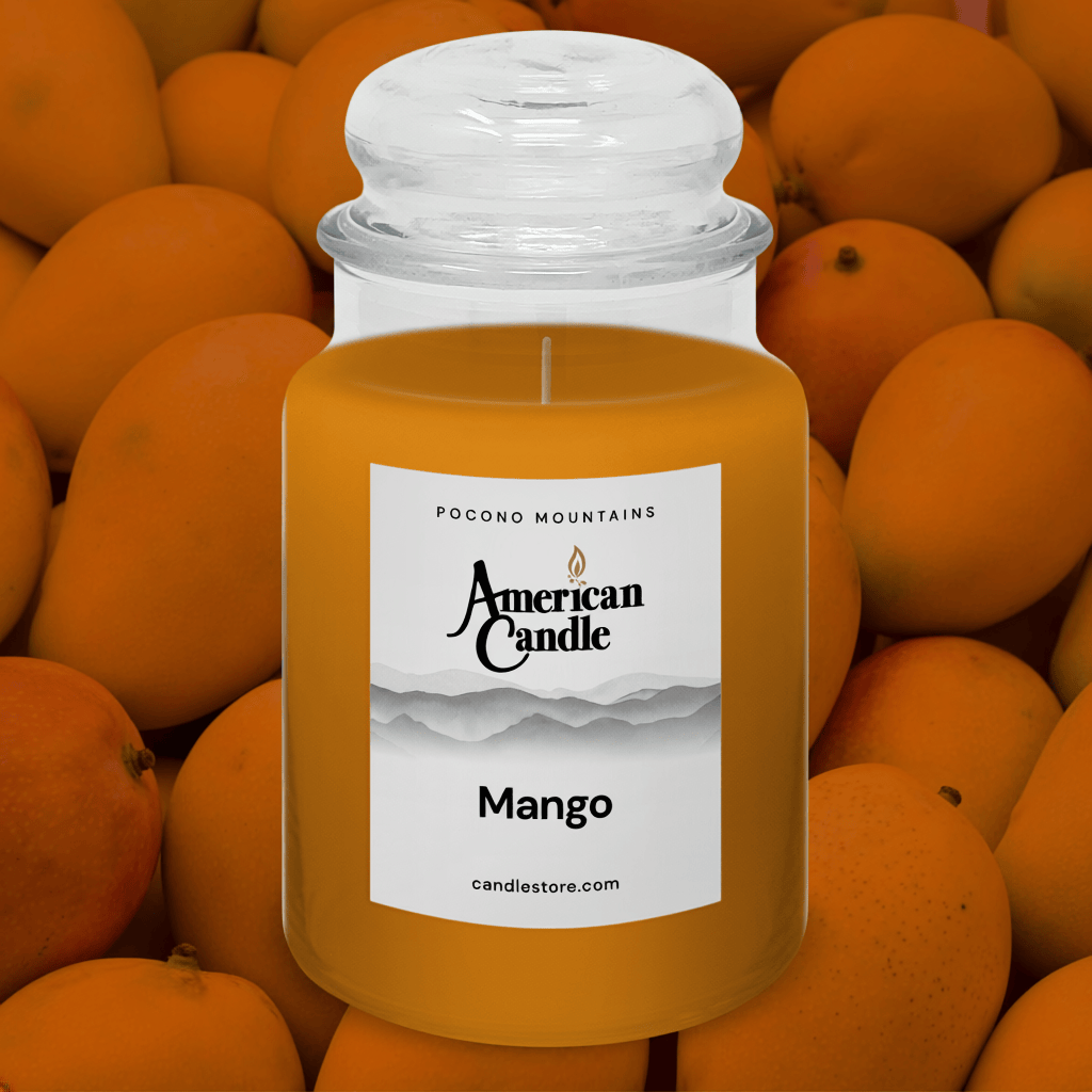 American Candle Mango scented jar candle surrounded by mangos in background
