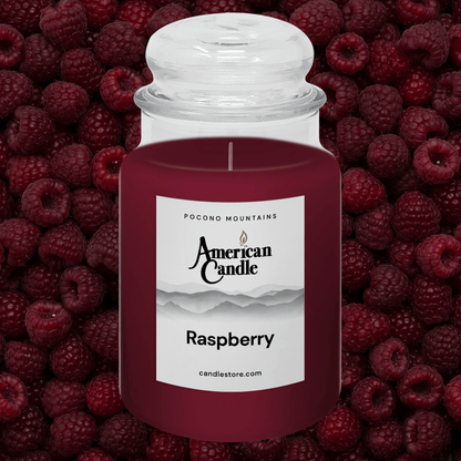 American Candle raspberry scented jar candle a background of raspberries