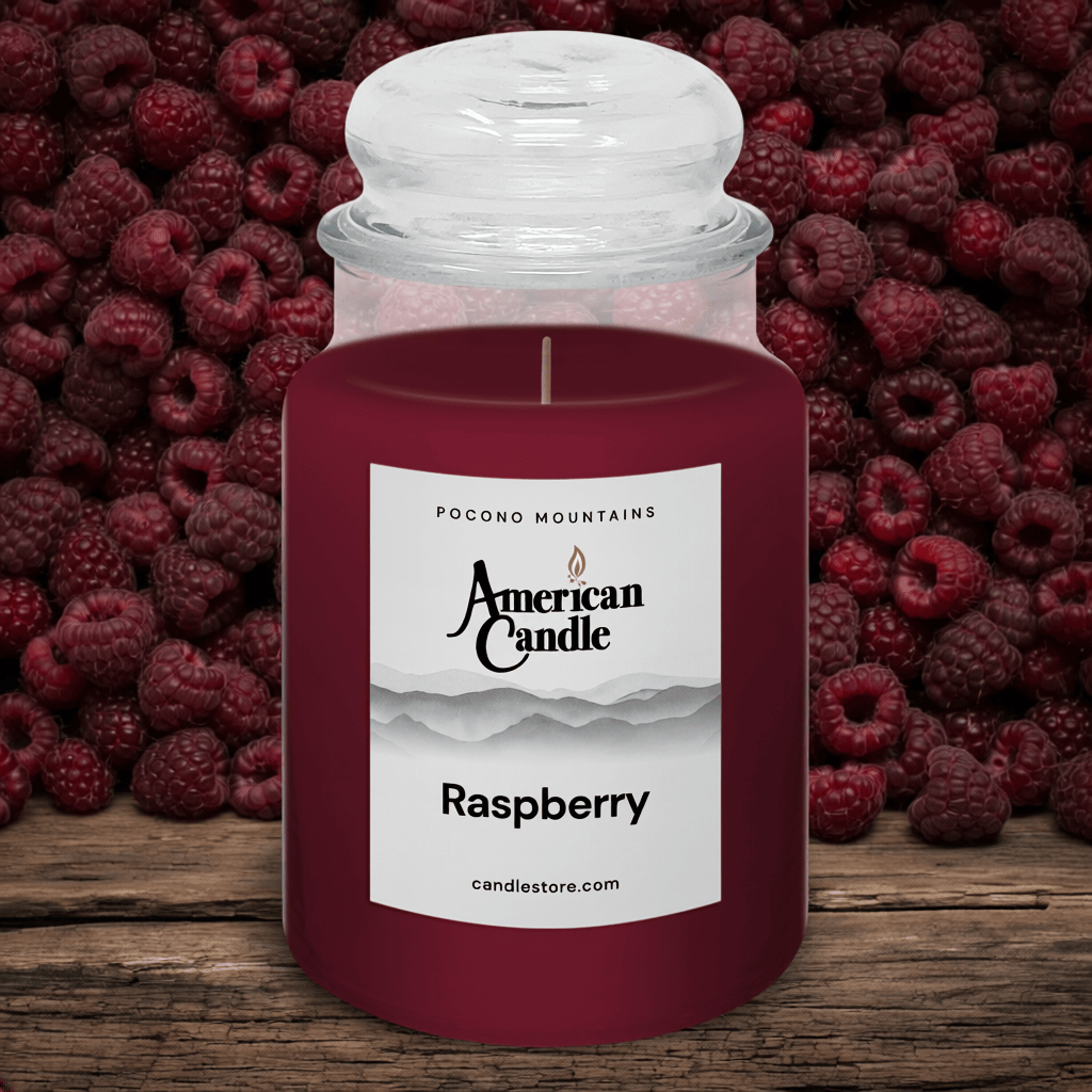 American Candle with raspberry scented jar candle in front of raspberries on a wooden table