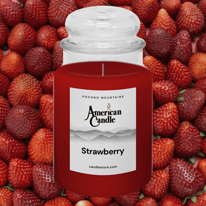 American Candle Strawberry scented jar candles surrounded by strawberries