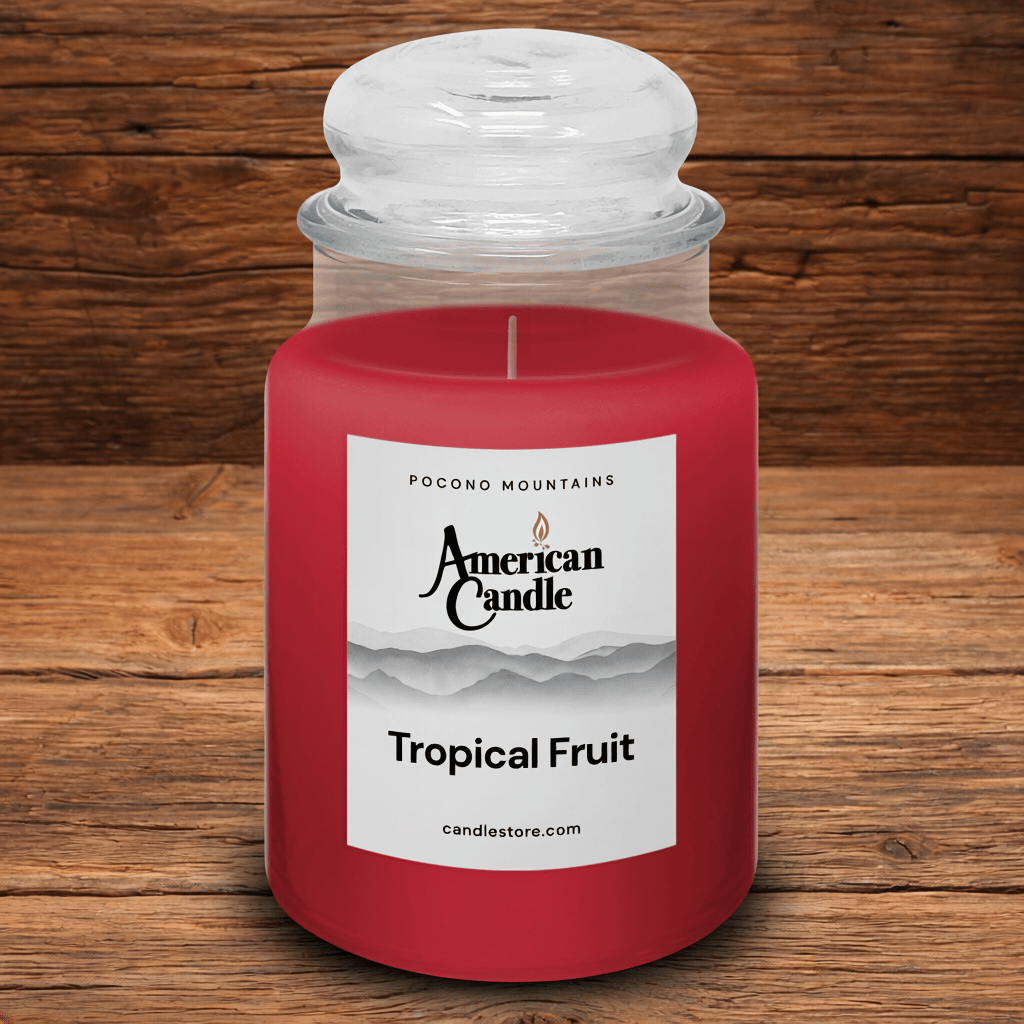 American Candle Tropical Fruit Scented Jar Candle on a wooden table